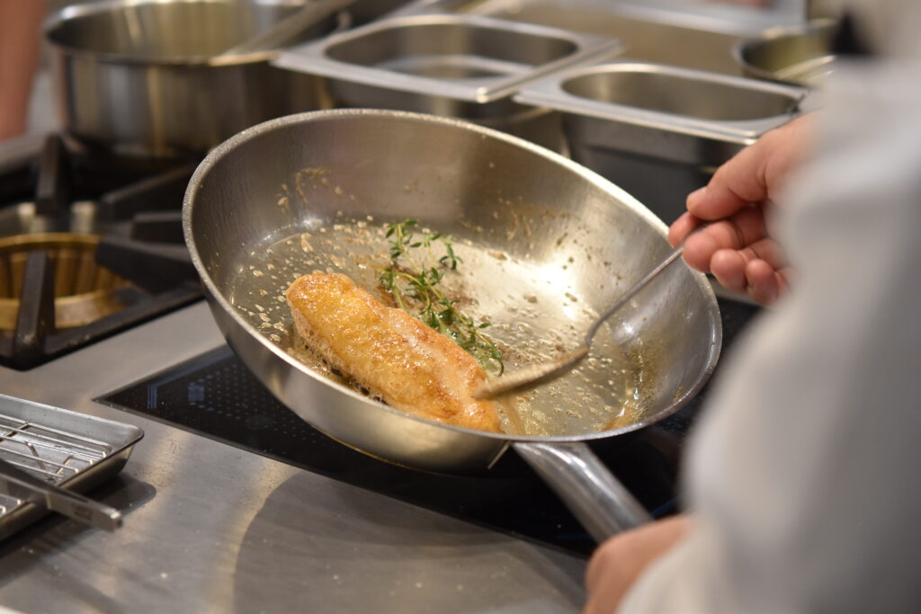 Students frying food