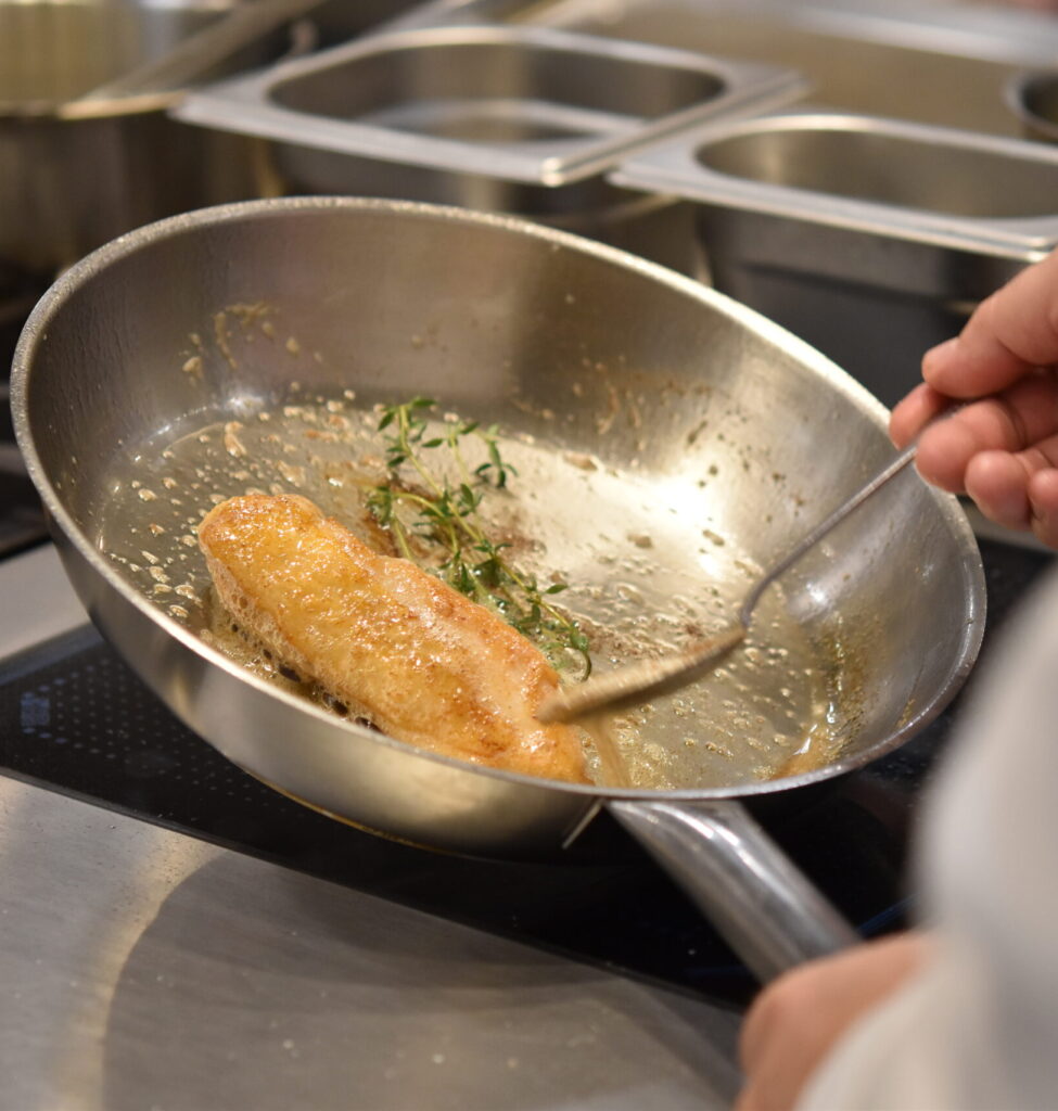 Students frying food